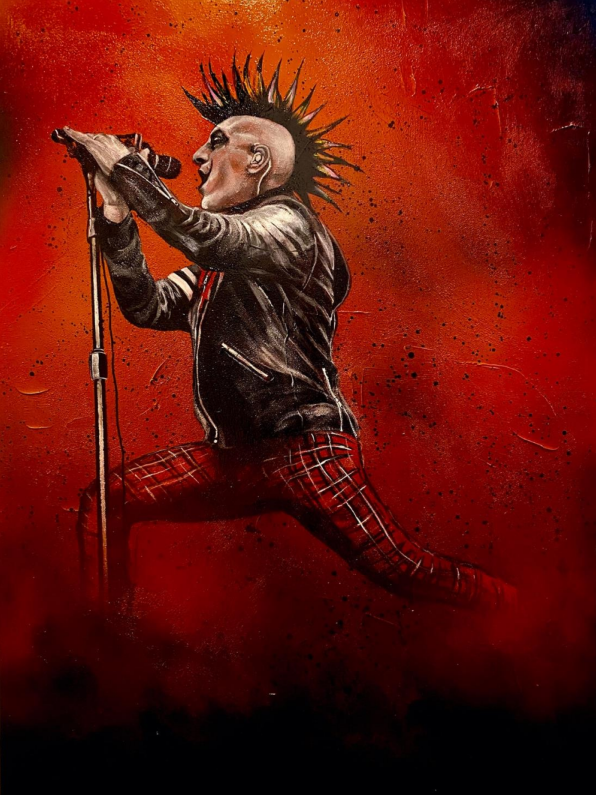Large-scale mixed media painting of a singer with a mohawk and red plaid pants performing against a fiery red background.