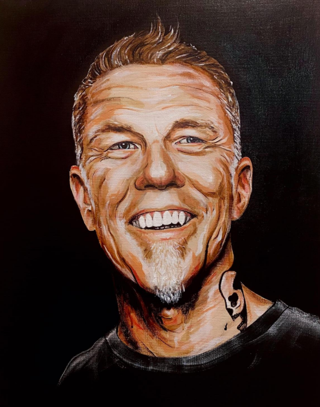 Artistic portrait of a smiling man with a black background